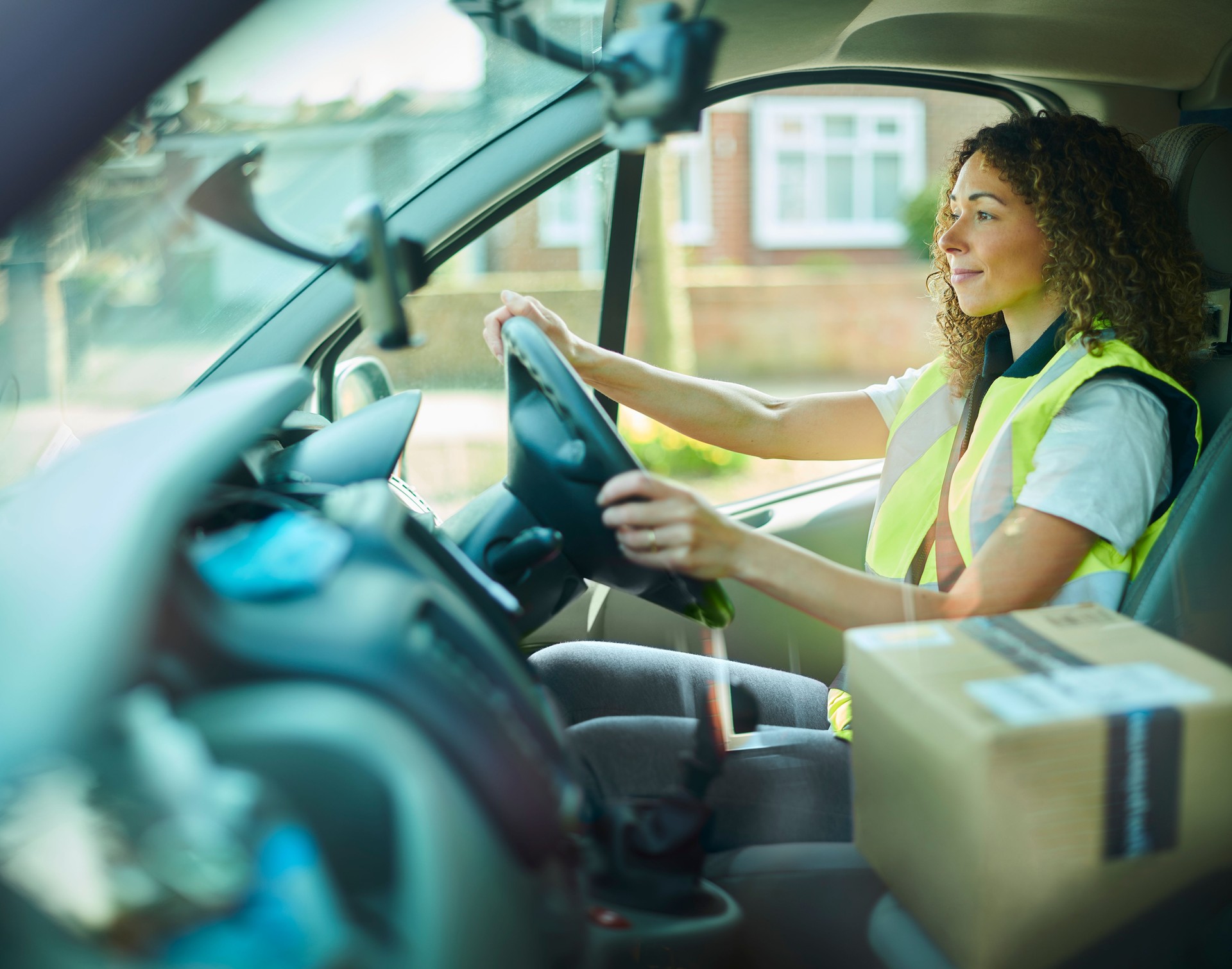 female delivery driver en route